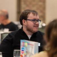 person sitting and smiling